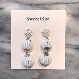 White beaded drop earrings